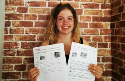 North Devon College A-level learner showcasing her results