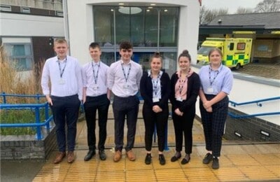 North Devon College students standing outside the hospital
