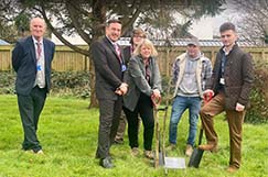 A group of North Devon College staff and students planting a tree to commemorative the Queens Jubilee
