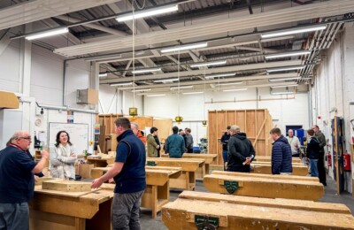 students and families in carpentry workshop