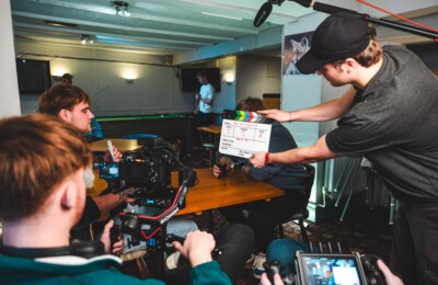 students on set filming their short film.