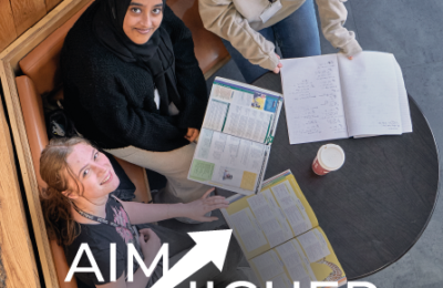Three students looking up at camera