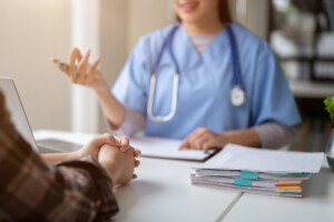 Close-up hand image of a patient having a medical consultation with a doctor