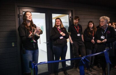 petroc animal care staff speaking to audience while holding a snake