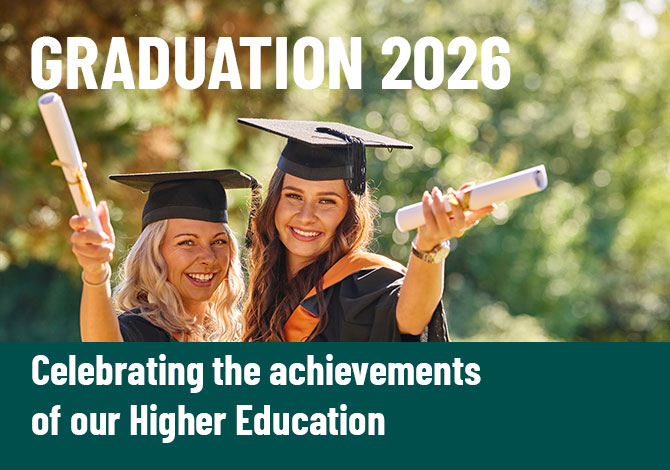 Two students celebrating their graduation