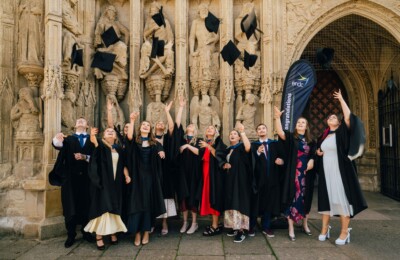 Graduates celebrating outside Exeter Cathedral